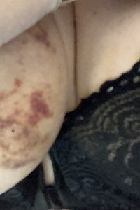 sensual chubby damsel playfully stripping off her clothes